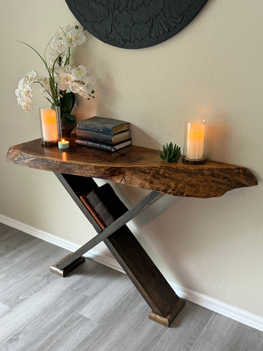 handcrafted walnut slab table with x legs showcasing unique grain pattern and live edge.