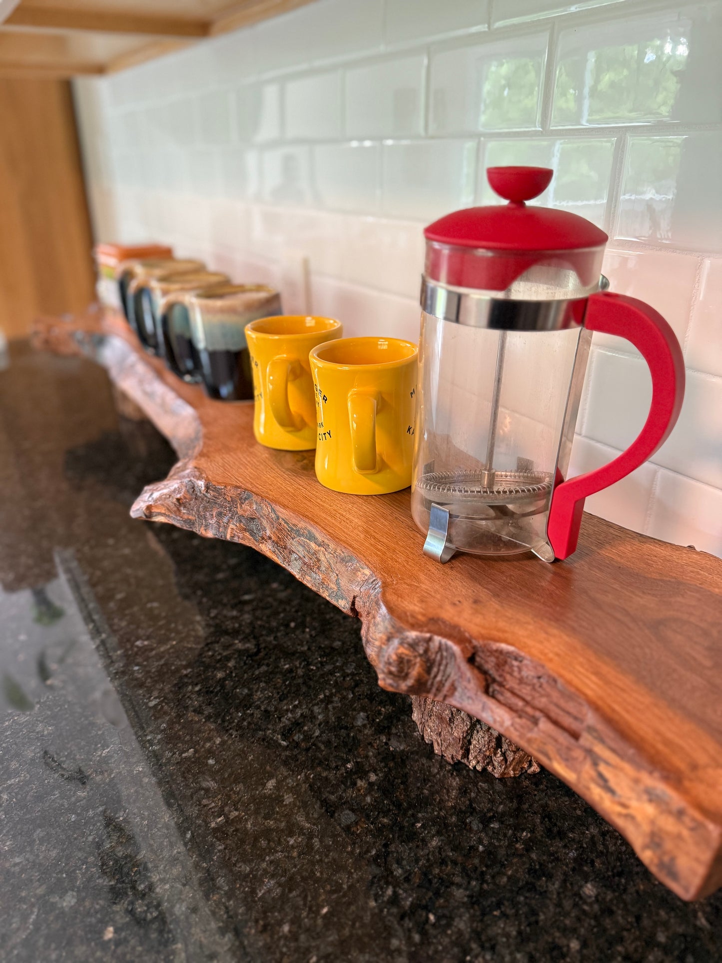 live edge coffee bar shelf staged with mugs and coffee press