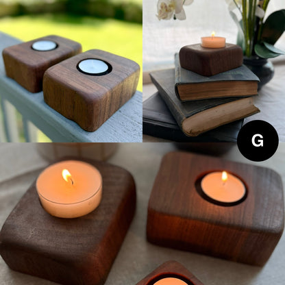 A set of two handcrafted walnut tea light candle holders labeled G, each with a similar shape and rich grain pattern. Shown styled with books, plants, and natural light.