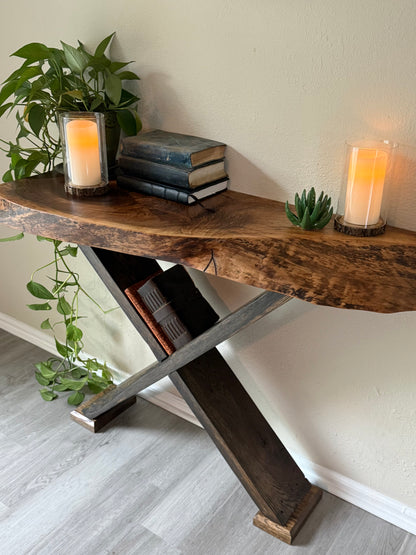 organic natural walnut slab console table styled with trailing greenery, books and candles