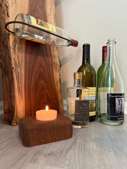 Handmade walnut wine rack styled with flowers and candle for home décor inspiration