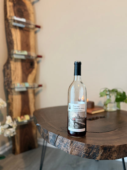 Wine rack in background with  wine bottle in foreground.